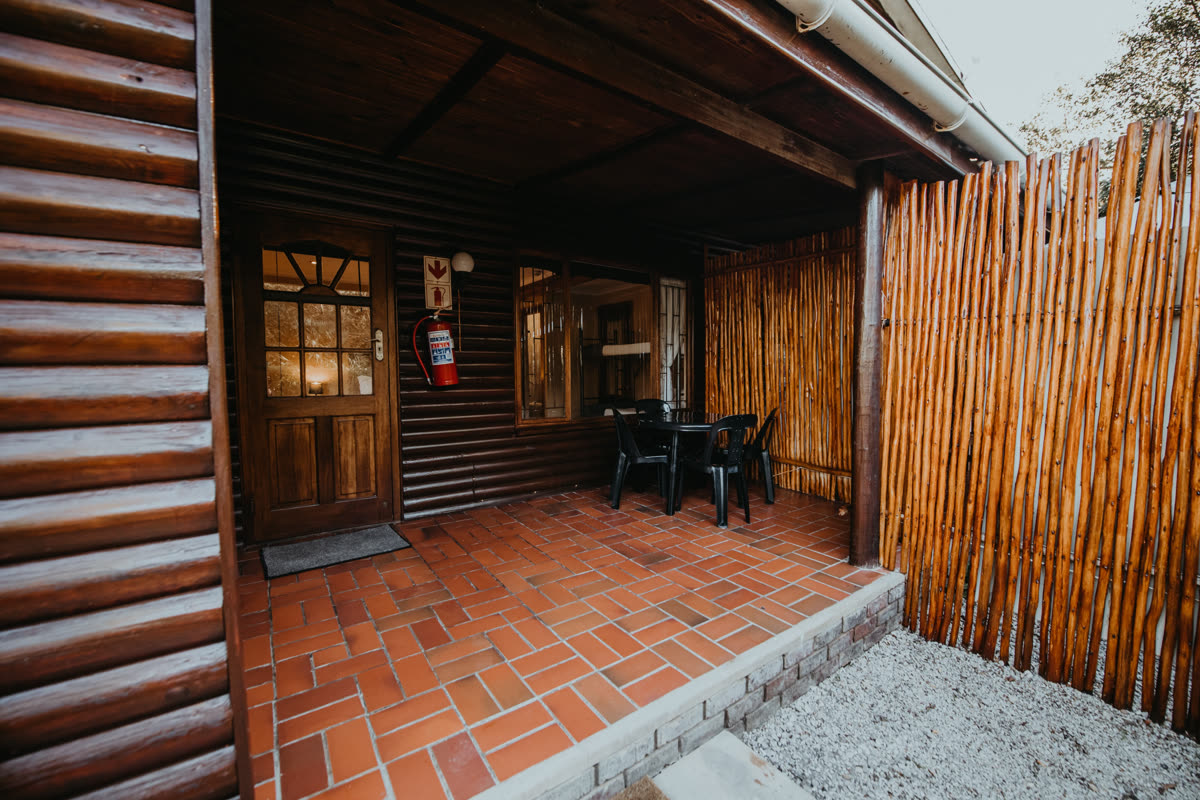 Log cabin room with covered patio and outdoor seating